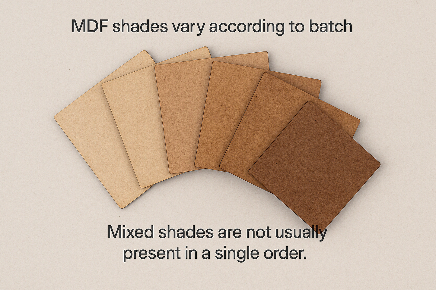 A set of MDF pieces arranged in a fan shape, showing natural colour variations from light beige to dark brown. The image illustrates how MDF shades can differ between batches.
