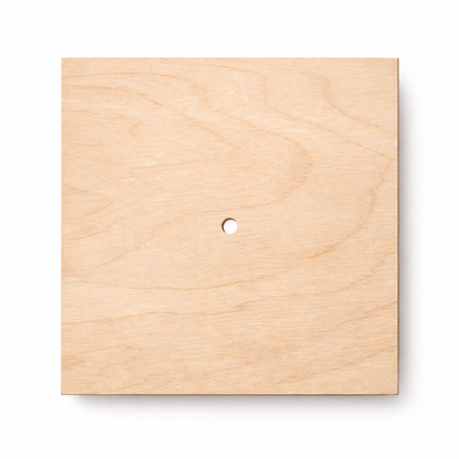 Square wooden clock face made from natural birch plywood with central hole for clock mechanism
