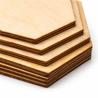 Close-up of laser cut hexagon wooden craft shapes showing dark brown edges and 3mm thick birch plywood layers