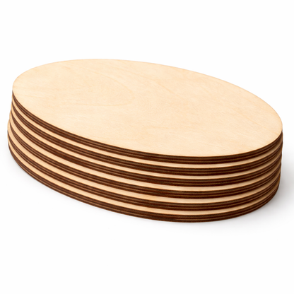 Stacked oval birch plywood craft shapes showing laser-cut edges and plywood layers
